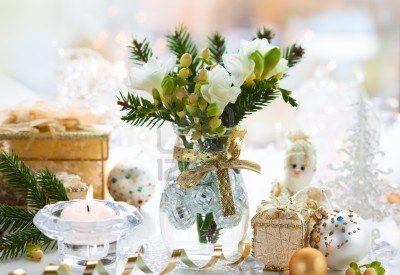 15884609-christmas-table-decoration-with-flowers-gifts-and-baubles