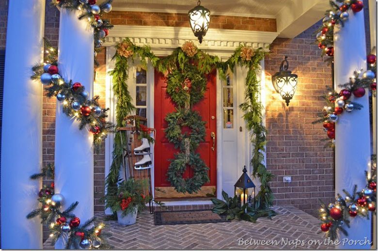 front-porch-decorated-for-christmas-with-triple-wreaths-on-door-and-pottery-barn-knock-off-garland