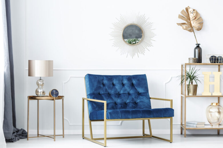 Blue,Bench,Between,Gold,Table,With,Lamp,And,Shelves,With