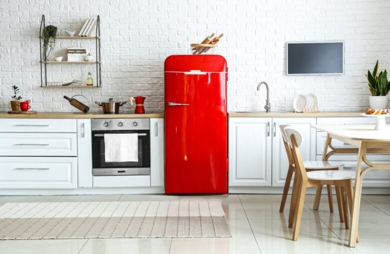 Interior,Of,Light,Kitchen,With,Red,Fridge,,White,Counters,And