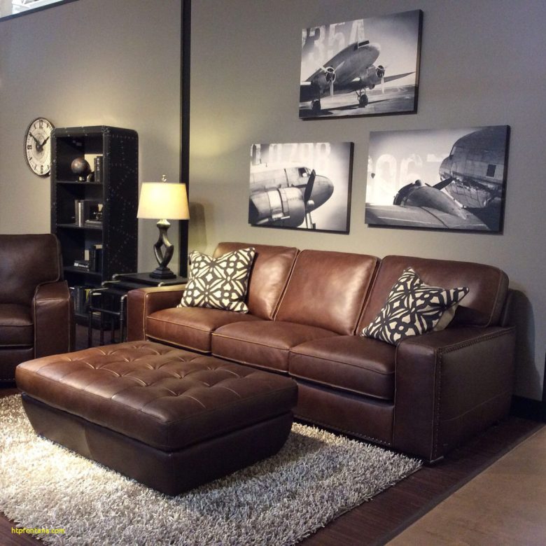 living room ideas with brown sofa Lovely family room with warm gray walls black and white art brown leather