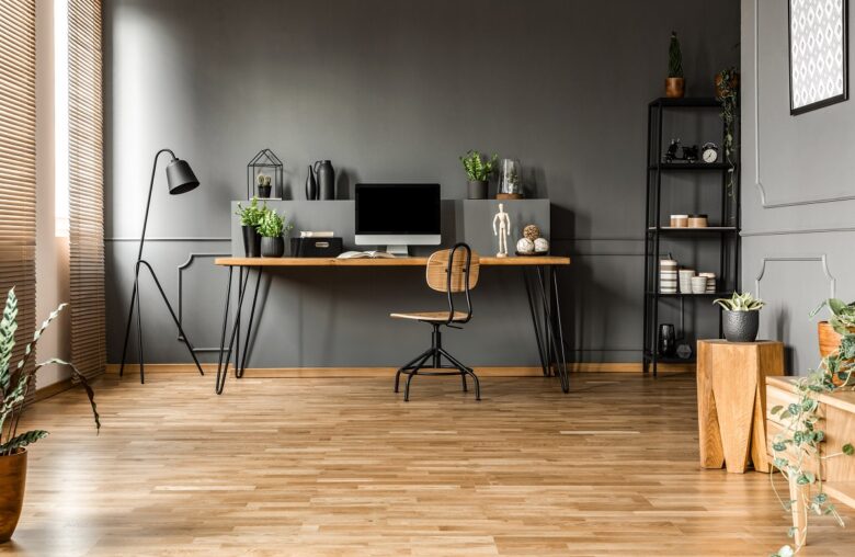 Chair,At,Wooden,Table,With,Computer,Monitor,And,Plants,In