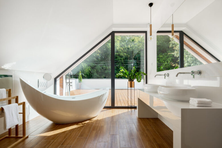 Elegant,Attic,Bathroom,With,Stylish,Bathtub,,Wooden,Floor,And,Balcony