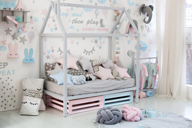Empty,Cozy,Children's,Room,With,A,White,Wall,With,Stickers,