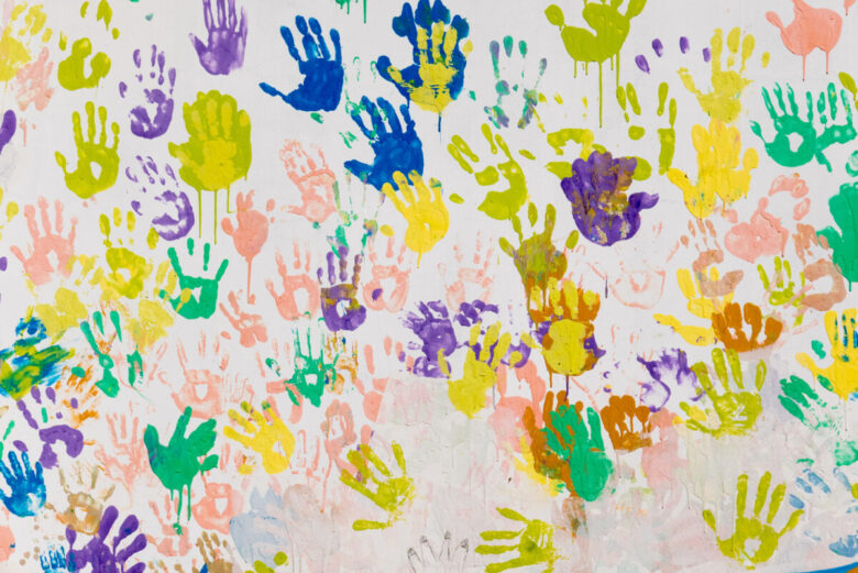 Wall,Covered,With,Colorful,Hand,Prints