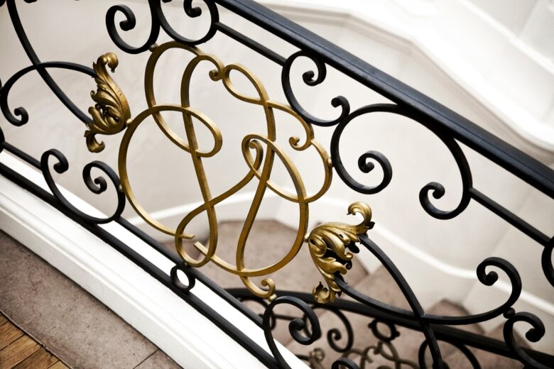 Interior,Of,A,Luxurious,French,Mansion,And,Golden,Stair,Railing