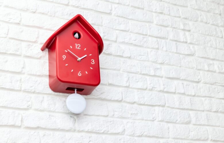 Red,Cockoo,Clock,On,White,Brick,Wall
