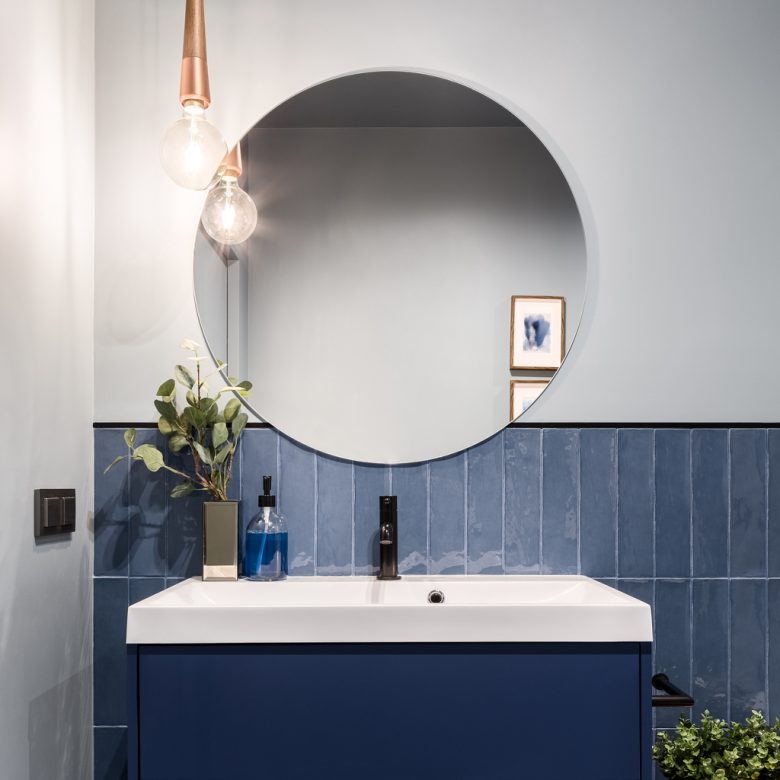 Bathroom with big round mirror