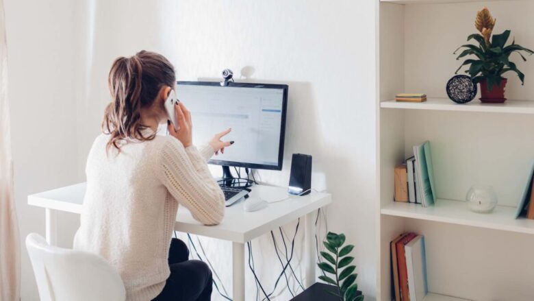 Work from home during coromavirus pandemic. Woman stays home. Workspace of freelancer. Office interior with computer
