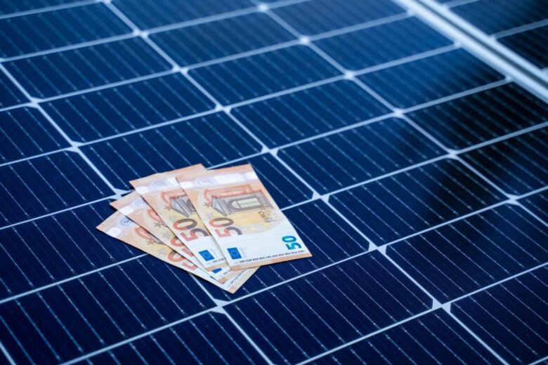 Energy,Saving,Concept,With,Solar,Panels,And,Fifty,Euro,Bills