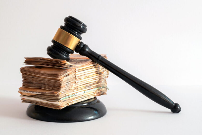 White,Background,On,A,Judge's,Hammer,Supported,By,A,Large