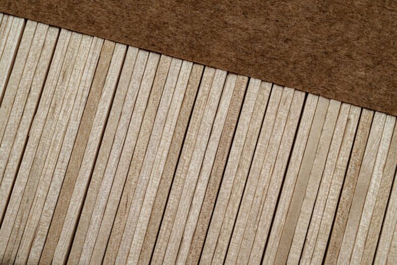An artistic close-up shot of parallel wooden planks creating a textured pattern.