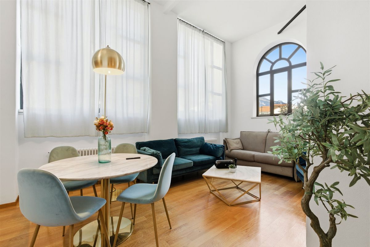 Contemporary living room featuring a cozy seating area with elegant decor and natural lighting. Contemporary living room featuring a cozy seating area with elegant decor and natural lighting.