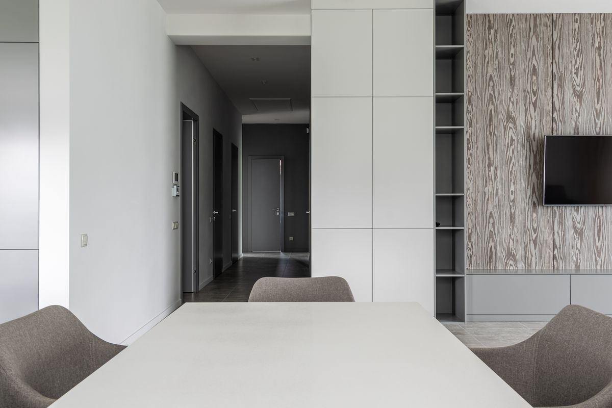 Comfortable interior of contemporary living room with modern table and chairs in daytime Comfortable interior of contemporary living room with modern table and chairs in daytime