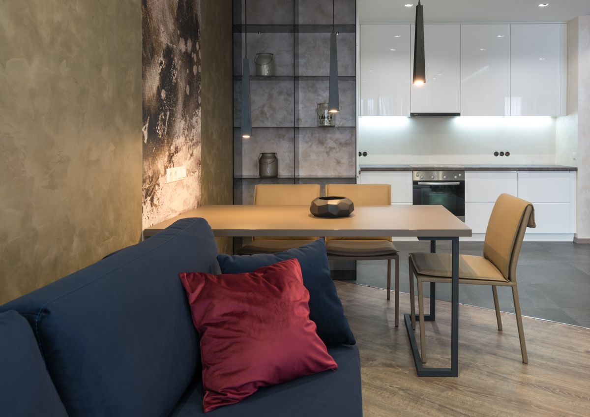 Elegant modern living room with minimalist design and contemporary furniture accents. Elegant modern living room with minimalist design and contemporary furniture accents.