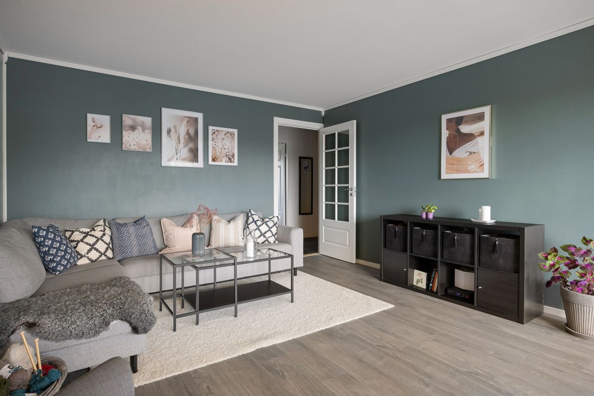 Contemporary living room featuring a cozy sectional sofa, coffee table, and decorative wall art. Contemporary living room featuring a cozy sectional sofa, coffee table, and decorative wall art.