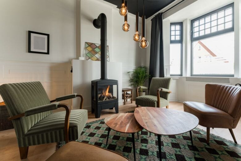 Inviting living room featuring a stylish fireplace, comfortable seating, and modern decor.