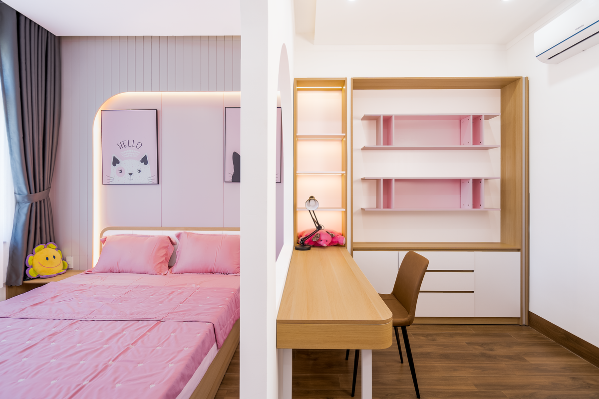 Stylish bedroom featuring pink bedding and a contemporary desk for a fresh interior design. Stylish bedroom featuring pink bedding and a contemporary desk for a fresh interior design.